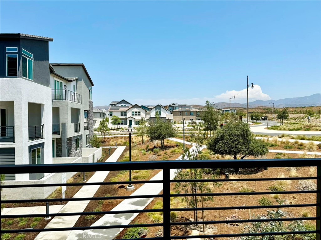 Stunning VIEWS! Park Front! Enjoy breathtaking mountain and city views from the master bedroom and covered deck in this luxurious brand-new home, built in 2024. Located in the highly sought-after community of Solis Park in Great Park, this 4-bedroom, 3.5-bathroom home offers a perfect blend of elegance and convenience.
Prime Location: Ideally situated on a corner lot with no neighbors or buildings in front, this home is flooded with natural light and enjoys refreshing ocean breezes. Just across the street from the prestigious Solis K-8 School and within walking distance to Portola High School, you'll appreciate the convenience of top-rated educational institutions nearby, making it an ideal choice for families.
Resort-Style Community: Solis Park offers an array of amenities, including a resort-like pool, club area, and kids' playgrounds, creating a perfect environment for an active and social lifestyle. Additionally, its central Orange County location provides easy access to dining, shopping, and major freeways.
Exceptional Living Spaces:
First Floor: Features a versatile suite perfect for visitors or a home office.
Second Floor: Boasts a bright and airy open layout with a spacious deck that offers stunning mountain and city views. The modern kitchen is a chef's dream, equipped with high-end appliances, sleek countertops, and ample storage space, seamlessly flowing into the living area designed for family gatherings and entertaining.
Third Floor: Houses two additional bedrooms and the luxurious master suite, providing a serene retreat with panoramic views.
This home combines modern luxury with ultimate convenience, making it an exceptional choice for those seeking a high-quality lifestyle. Don't miss the opportunity to lease this exquisite property in Solis Park. Schedule a private tour today and experience the best of Great Park living!