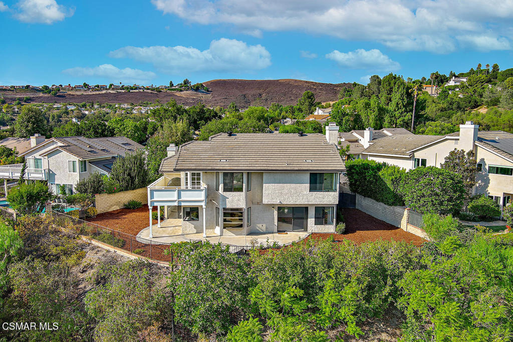 Absolutely gorgeous with Panoramic VIEWS, VIEWS VIEWS EVERYWHERE! One of the largest models and Upgraded 5 Bedroom home with 1 downstairs bedroom + Bathroom, and 3 car garage, situated in the desirable Lang Ranch * Brock Collection neighborhood of East Thousand Oaks/Westlake Village. Open floor plan with soaring vaulted ceilings, and numerous windows dressed with views which provide a bright and spacious atmosphere. Family room, offers a gas burning fireplace, and is adjacent to the beautifully designed and completely remodeled kitchen with Quartz countertops. Newer modern floors throughout, 9' ceilings, indoor laundry and more. The spacious master suite offers fantastic mountain and hillside views, wrap around balcony to enjoy those amazing views, has spacious walk in closet and a private bathroom with large soaking tub, separate shower and vanity with dual sinks. Such a wonderful place to call home and entertain guests. Easy freeway access, close to shopping, multiple parks and a block away from the award winning Lang Ranch Elementary (offering fantastic after school care and summer camp) Westlake High School, are all close by.