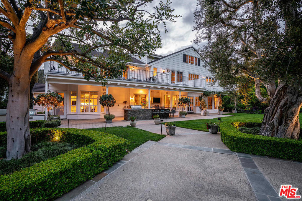 In the exclusive guard gated Ridgeview Estates, sits an entertainer's delight. On nearly 2 acres, w/ an oversized tennis court, relaxing pool area, built in firepit & bbq, & an expansive grassy yard, one will never want to leave! W/ 6 beds & 8 baths, this 3 level masterpiece provides a retreat. You'll appreciate the voluminous ceiling heights & views looking out to the envious backyard. W/ large dining rm, generous living & adjoining family rms leading out to the yard, there's an easy entertaining flow. 2nd floor has 4 en suite beds, w/ individual private balconies extending along the entire back, overlooking majestic mountain views. Entire 3rd fl is an open bonus rm w/ additional 1700 sqft of storage (nic in sqft). W/ pool, tennis court, bar, lounging & rec areas, ocean & mountain views, there's no need to leave this private sanctuary. Imagine having your children's birthday parties, weddings or large parties in this private, park-like setting. This amazing estate is truly special.