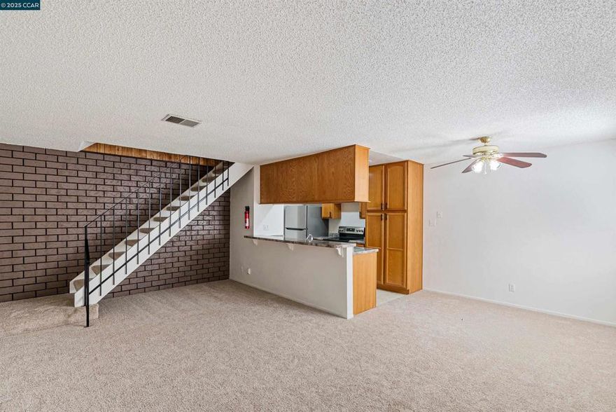 Welcome to 2205 Lemontree Way Unit 3 — an inviting two-story condo offering comfort, convenience, and great value! This light-filled home features two spacious bedrooms, one full bath, a bright family room, and a cozy eat-in kitchen with a breakfast bar. Enjoy a new large stainless steel refrigerator, newer dishwasher, well-maintained window shutters, and a mature orange tree in front that adds natural charm. Recent updates include new carpet, fresh paint, and an updated bathroom. The open layout makes it a great choice for first-time buyers or investors. Added benefits include a shared garage with private storage, an additional reserved parking space, and a community with water, garbage, and sewer included in the HOA. Take advantage of a sparkling pool, clubhouse, and on-site laundry facilities. Conveniently located near Hwy 4, BART, schools, shopping, restaurants, and parks — this home combines affordability and accessibility in one great package!