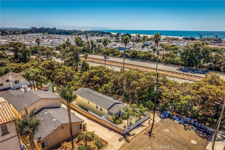 Charming 1930's classic beach bungalow in Pismo Beach! This delightful 1-bedroom, 1-bathroom home welcomes you with an inviting enclosed porch nook. The open floor plan seamlessly connects the family room, breakfast nook, and kitchen, which boasts new stainless steel appliances. The bathroom features a timeless black and white design with a newly tiled shower. An indoor laundry closet is conveniently located down a short hall leading to the bedroom.



Step outside to a spacious backyard perfect for gatherings and gardening, adorned with fruit trees and beautiful ornamental plants. Enjoy a leisurely walk or bike ride to the beach in downtown Pismo and explore nearby walking trails just outside your front door. Nestled in a private setting, this charming beach house is sure to steal your heart!

Square footage includes enclosed porch area.