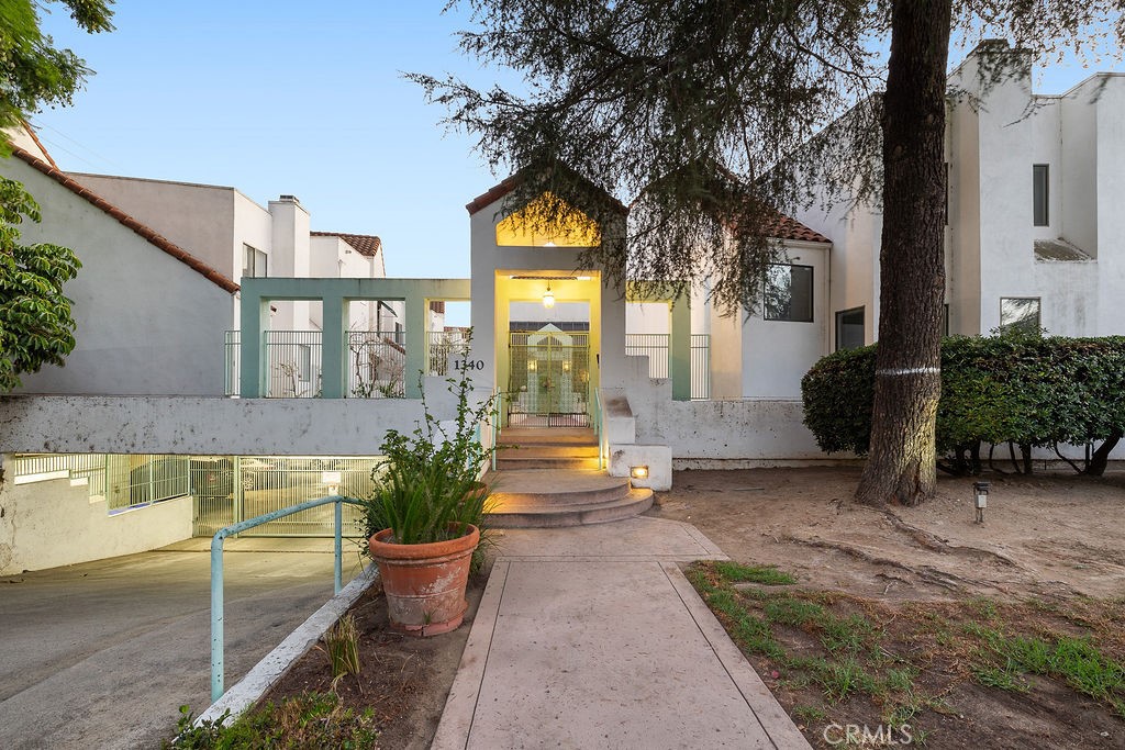 Experience refined living in this beautifully remodeled townhouse, blending modern comfort with timeless elegance.
Completely renovated in 2019, this move-in-ready residence showcases impeccable attention to detail throughout. The spacious living room features a sophisticated fireplace and flows seamlessly into the expansive formal dining area, perfect for entertaining. Sliding doors open to a large, private patio—an inviting space for relaxation or alfresco gatherings.
The designer kitchen is equipped with sleek cabinetry, newer stainless-steel appliances, and an oversized pantry offering exceptional storage. A custom-crafted staircase with elegant iron railings leads to two serene upstairs bedrooms, each with its own luxuriously remodeled en-suite bathroom. The convenience of an upstairs laundry room enhances everyday living.
Nestled at the peaceful end of the complex, this home also includes two side-by-side parking spaces and a private storage area in the secure subterranean garage. Located just a short stroll from Kenneth Village and scenic Brand Park, this exceptional townhouse offers the perfect blend of style, comfort, and prime location.