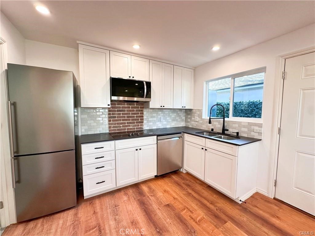 Welcome to this stylish and modern ADU, perfectly situated in the quiet and peaceful neighborhood of Reseda. This thoughtfully designed home features an open floor plan with luxury vinyl flooring and dimmable recessed lighting, creating a bright yet cozy ambiance. Enjoy the convenience of quality name-brand newer appliances, split AC/Heating, and your own in-unit washer & dryer. The sleek kitchen flows seamlessly into the living space, making it perfect for both relaxing and entertaining. Centrally located near shops, restaurants, and easy freeway access, this home is ideal for professionals who live and work in the area.
