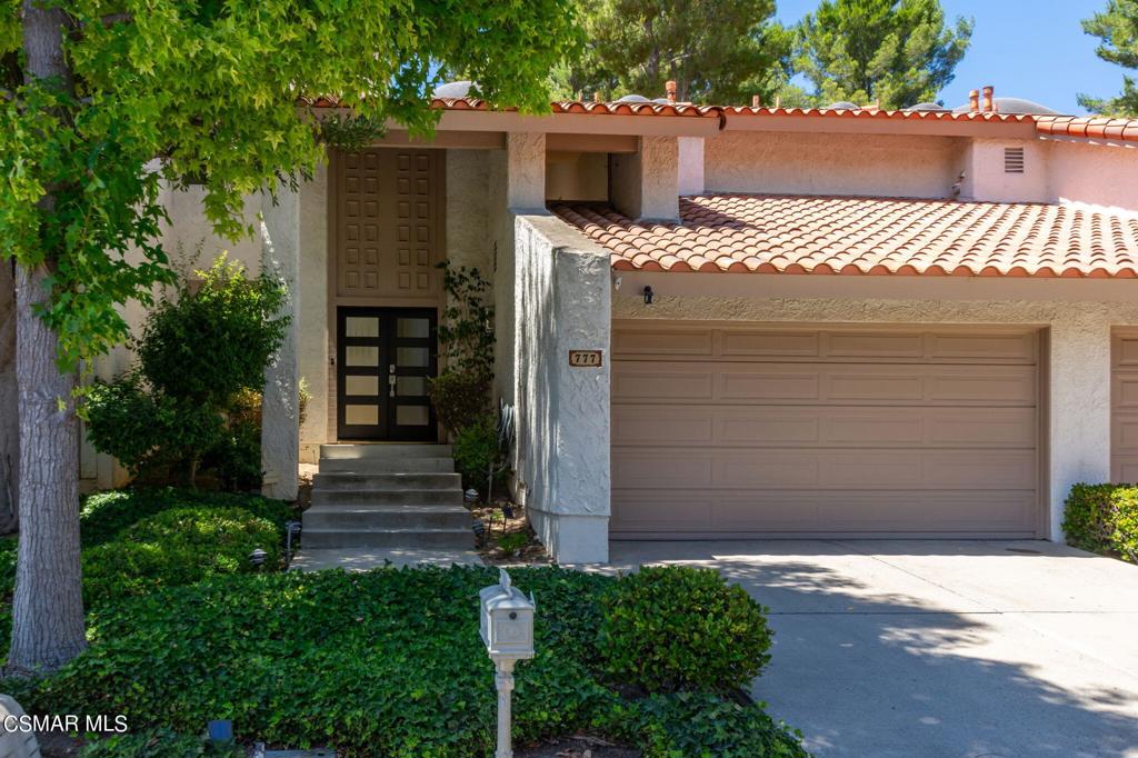 This beautifully remodeled townhome seamlessly blends contemporary and mid-century design elements with thoughtful upgrades throughout. Perfect for entertaining, the stylish interior boasts luxury vinyl plank flooring, custom stair railings, and oversized skylights that flood the space with natural light. The open floor plan connects the gourmet kitchen to the family and dining areas, featuring quartz countertops, newer cabinetry with soft-close hardware, under-cabinet lighting, stainless steel appliances, and a wine/beverage fridge. Step outside through sliding doors in the family or living room to a private rear patio, where you can relax surrounded by lush greenery. The primary suite offers a tranquil retreat with a balcony overlooking the hillside, a spa-quality bathroom with dual vanities, designer light fixtures, an oversized double shower, and a custom closet. Each spacious secondary bedroom also includes a balcony with hillside views, designer walnut doors, plush carpeting, and custom closets with mirrored doors.Smart home features include a Lutron Caseta controlled LED lighting system, Nest thermostats, a sprinkler system, a smart entry lock, and 220 volt car charging station in the garage. Additional conveniences include a direct access two-car garage, indoor laundry, community pool, and a prime cul-de-sac location. The exclusive Northgate neighborhood is in a most sought-after Westlake Village location with easy access to schools, fine dining, entertainment, shopping and freeways to Santa Barbara, Simi Valley, Los Angeles and local beaches.