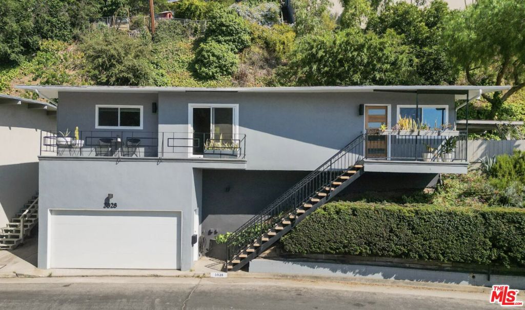Mid-Century Modern Retreat in NELA neighborhood / Glassell Park. This stunning post-and-beam home offers an open floor plan with 3 spacious bedrooms and 2 baths. The primary suite features an en-suite bath and direct access to a wraparound patio with sweeping city, hillside, and mountain views. Each bedroom is thoughtfully designed with sliding-door closets, and provides ample storage throughout the home. The well-equipped kitchen offers cabinet space, a breakfast bar and casual dining, kitchen appliances are included. The expansive living room opens to a front-facing balcony with views, while the dining area and kitchen capture scenic vistas of the Griffith Observatory. Original architectural details shine throughout, including wood-paneled ceilings, exposed beams, and gorgeous hardwood floors. Enjoy quintessential LA indoor-outdoor living with multiple entertaining spaces: a rear patio perfect for dining al fresco, plus a large gazebo ideal for gatherings or quiet relaxation. Additional highlights include HVAC, a two-car garage with EV hookup, newer windows and doors, and thoughtful mid-century details throughout. Located in desirable Glassell Park, a NELA gem known for its creative energy, hillside homes, and community vibe. Residents enjoy proximity to trendy coffee shops, local restaurants, neighborhood markets, and parks plus easy access to DTLA, Griffith Park, Eagle Rock, Echo Park, Los Feliz, and Highland Park.
