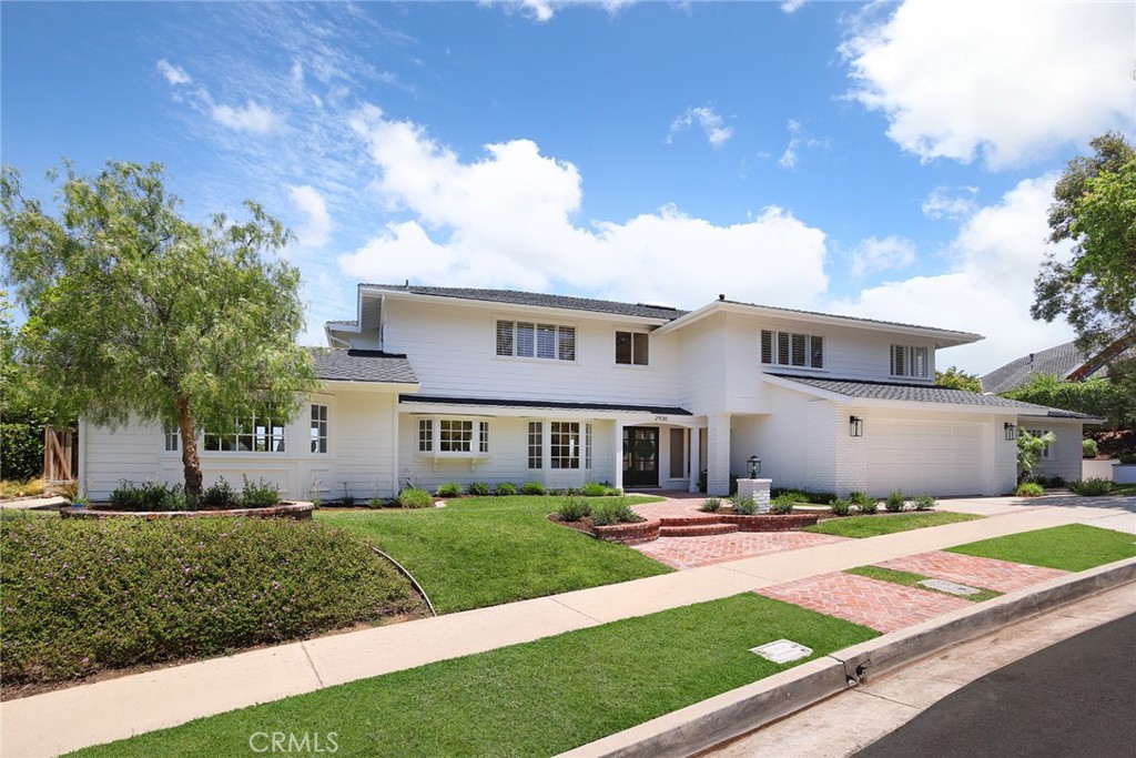 Welcome to 2936 Alta Vista — a beautifully maintained traditional residence nestled on one of the largest lots in the highly sought-after Eastbluff neighborhood of Newport Beach. Perched on nearly 12,000 square feet, this expansive home offers over 4,200 square feet of versatile living space and showcases sweeping views of the surrounding mountains and city lights. Designed with both function and comfort in mind, the home features five spacious bedrooms, four full baths, and multiple living areas—including a formal living and dining room, a warm and inviting family room, and a large bonus/media room complete with wet bar and temperature-controlled wine cooler. Upstairs, the luxurious primary suite is a true retreat, offering an oversized walk-in closet, and a spa-like bath with a soaking tub, walk-in shower, and breathtaking views. The gourmet kitchen is a chef’s dream with a 6-burner range, dual ovens, farmhouse sink, granite countertops, and abundant cabinetry. Step outside to your private backyard oasis, complete with a newly resurfaced PebbleTec pool and spa, outdoor shower, cozy fireplace, grassy play area, and lush landscaping dotted with mature fruit trees. It’s the ideal setting for year-round entertaining. Additional highlights include four fireplaces (three indoors), skylights and French doors that enhance natural light and create seamless indoor-outdoor flow, a newly installed roof, white oak wood flooring, dual-zone air conditioning, a spacious mudroom off the garage, and a full laundry room with sink. With no Mello Roos and low HOA fees, and located just minutes from award-winning K–12 schools, top-tier dining and shopping, the Newport Beach Tennis Club, Back Bay trails, and convenient freeway access, this rare gem blends timeless elegance with modern convenience in one of Newport Beach’s most coveted communities.