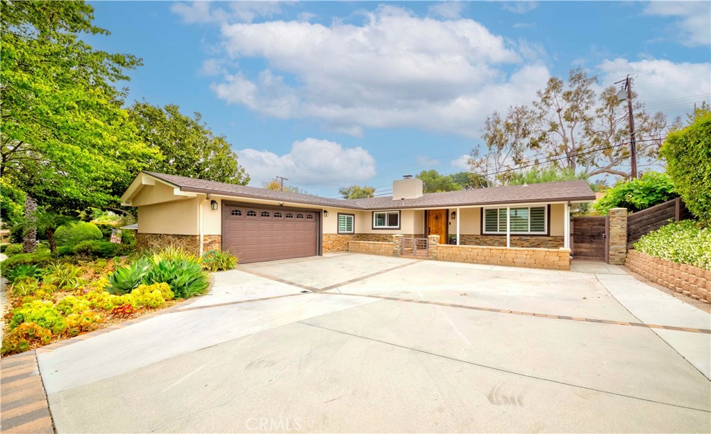 Welcome to this beautifully remodeled single-story home, nestled in the peaceful surroundings of Rolling Hills Estates. Designed for comfort and tranquility, this residence offers the feel of a private mountain retreat right in the heart of the South Bay. Step into your serene backyard oasis, surrounded by natural habitat with birds and wildlife, creating the perfect setting for relaxation and privacy. The low-maintenance landscaping was thoughtfully updated in 2024 with high-quality pavers, a concrete patio, and premium Trex decking, ideal for outdoor entertaining or quiet moments of peace. Inside, the primary suite serves as a true sanctuary, while the additional bedrooms feature soaring ceilings. The home also includes a dedicated laundry room, a remodeled kitchen with top-tier cabinetry and countertops, and a host of modern upgrades: solar system, new ductwork, EV charging, newer electrical panel, sprinkler system, and proper drainage. Experience elevated living in a home that combines timeless style with practical, eco-conscious upgrades, your private escape awaits.