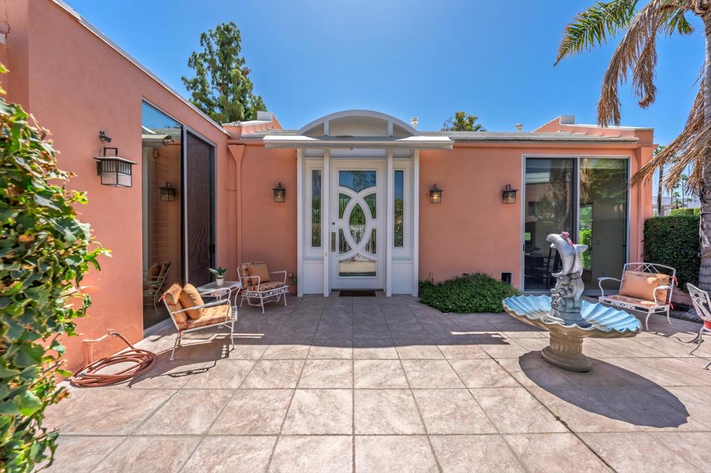 Experience Iconic Desert Living with Sweeping Mountain and Fairway Views!Welcome to this wonderful residence in the coveted Marrakesh Country Club - an expanded C-plan with two spacious primary suites and a versatile 3rd bedroom, perfectly positioned to capture breathtaking views of the Eisenhower Mountain, twin fairways, tranquil lakes, and sparkling fountains. Marrakesh is home to just 364 Hollywood Regency villas designed by John Elgin Woolf, famed for shaping the glamour of 1950s-60s Hollywood and designing homes for legends like Cary Grant and Judy Garland. His vision of timeless elegance and modern luxury lives on in Marrakesh's dramatic pink facades, colonnaded porticos, and refined symmetry. From the moment you enter the oversized front doors, you'll be captivated by the soaring ceilings, walls of glass and elegant architectural detailing. The chef's kitchen is equipped with custom cabinetry, granite slab countertops, stainless steel appliances, a wine cooler, a walk-in pantry, and a spacious breakfast nook with direct access to the sunny front courtyard - ideal spot for savoring your morning coffee or entertaining under the stars. The primary suite offers a serene retreat with a large walk-in closet, an updated ensuite bathroom with soaking tub, and access to the back terrace bathed in soft morning light. A second suite opens to the sunny front courtyard, while the 3rd bedroom with its own private patio and ensuite bathroom access, makes the perfect guest or flexible space. Located just a short stroll from the clubhouse and pool, this turnkey furnished home offers seamless access to Marrakesh's resort-style amenities including 18-hole executive golf, tennis, pickleball, and fine dining in the recently renovated clubhouse with gorgeous mountain views. Tucked away in the heart of South Palm Desert, Marrakesh is surrounded by some of the desert's most prestigious private clubs - Bighorn, The Reserve, and The Vintage, and close to world-class attractions like The Living Desert, McCallum Theatre, and Indian Wells Tennis Garden. Whether you are seeking a sophisticated seasonal retreat or a full-time residence, this home is your invitation to live the quintessential desert lifestyle with style, comfort, and history.