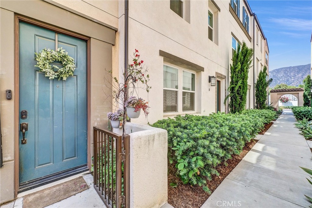 Welcome to Unit 11 at 645 W Foothill Blvd, an exceptional end unit in Glendora’s desirable Foothill Collection community. This tri-level townhome, built in 2017, spans approximately 1,870 square feet and features three bedrooms and four baths—offering space and privacy for family and guests. What truly sets this home apart is the expansive rooftop deck, designed for entertaining, where you can host sunset dinners or enjoy morning coffee while taking in sweeping mountain and foothill views. As one of the few units in the community with a side yard, you'll appreciate the convenience of exterior storage—perfect for trash cans or bikes—without cluttering your garage or entryway.
Inside, the open-concept living space is flooded with natural light, seamlessly connecting the living room, dining area, and kitchen. The ground floor bonus room offers flexibility as a home office, media space, or guest suite, while the attached two-car garage ensures convenience and security.
This gated community enhances daily life with a resort-style pool, spa, barbecue area, and playground. Just a short walk or bike ride away is charming Downtown Glendora, where you’ll discover a vibrant mix of boutiques, cafés, restaurants, and frequent community events. The area combines small-town charm with modern amenities and easy access to the 210 freeway, making it perfect for commuting or weekend getaways.
Situated in a lively, welcoming community and offering upscale indoor-outdoor living, this home delivers the best of Glendora. Contact us today to explore this rare find for yourself!