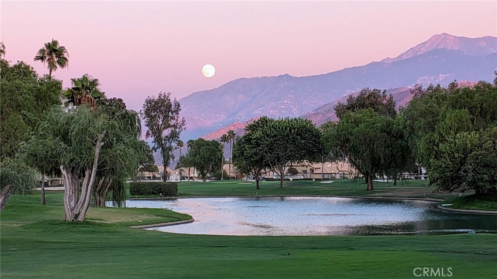 PANORAMIC Golf Course, Mountain, Lake(s) & Night Light VIEWS FROM THIS EXPANDED & COMPLETELY REMODELED ONE-OF-A-KIND HOME (1,618 Sq Ft) The Current Owners have put in approx $145,000 in Gorgeous Upgrades, which is IN ADDITION to the Home Expansion and A/C Replacement done prior. This Exquisite Home offers TWO Re-Configured & Remodeled PRIMARY 'EN SUITE' BEDROOMS & Baths, located at opposite sides of the home, each bringing it own custom designs (Expanded Closets & Baths with Quartz & Marble Stone, Enlarged Shower and a SAUNA); Other Features include: Top Quality Porcelain 24x24 Crema Marfil Flooring imported from Spain; New 8' & 9' Sliders & Many New Windows providing Stunning Views & Amazing Natural Light Flow - Triple Glazed Bay Windows in the Front BR Suite; Built-In TV Cabinet with Dimplex 33" Milti-Fir XD Fireplace (open with a wave of the hand). The Remodeled Kitchen has been thoughtfully custom designed with all new Cabinetry (30" pull out shelving), Classy Pulls & Knobs & a Refrigerator surrounded by custom cabinetry (like sub-zero), New 2025 Dishwasher; Custom Lighting & Ceiling Fans throughout the Home. There is a Built-In Office/Work Station Adjacent to Kitchen. The Patio is like an Outside Living Room, with a Patio Cover running the entire length of the Home, Ceiling Fans, A Fountain & Newer Polycarbonate Skylights - And this Stunning home is a very short walk to main Clubhouse (Restaurants, Bar & Lounge Fitness Center, Pool & Spa and SO many activities........ Sun Lakes Country Club goes beyond just a place to live - It's a vibrant community designed to keep you Active & Engaged, offering: TWO 18-HOLE GOLF COURSES with 2 Pro Shops, THREE Clubhouses, TWO Restaurants, Bar & Lounge, Tennis, PICKLE BALL COURTS, Pools (Including Large Indoor Pool), Jacuzzi Spas, THREE Fitness Centers & Fabulous Planned Activities Offered on a Daily Basis. There are 80+ Social CLUBS, and If that's not Enough, Add TRIPS AND TRAVEL EXCURSIONS scheduled all year long. Association Dues INCLUDE CABLE TV & INTERNET - The community is Located Close to Casinos, World Famous Shopping (Cabazon and Palm Springs), Restaurants, and Excellent Medical Facilities
