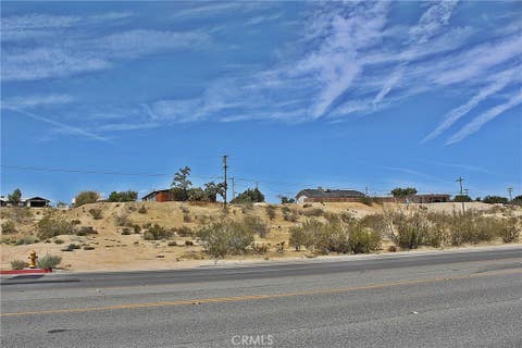 Photo of 11 Village Drive, Victorville, CA 92395 (MLS # HD26174430)