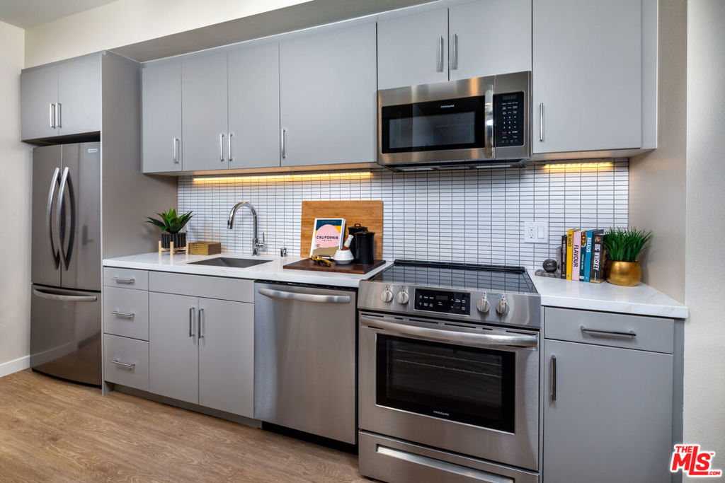 Welcome to your brand new home, where luxury living meets the vibrant pulse of everyday lifestyle. Nestled amidst nature yet close to city conveniences, this brand new two bedroom, two bath unit is equipped with smart home technology and upscale finishes. This top floor corner unit, with a corner patio balcony offering sunset views to the west and views of the Hollywood Hills to the north. Includes top of the line appliances, spacious walk-in closets, and washer/dryer. The building offers the most sought after amenites, with access to two pools, two fitness studios, two lounges, underground parking, EV chargers and much more. With curated ground-floor retail coming soon adding conveniece to your daily routine. Surrounded by local dining, shops, art galleries, entertainment venues, and more. Welcome home! *some photos may be of similar units.