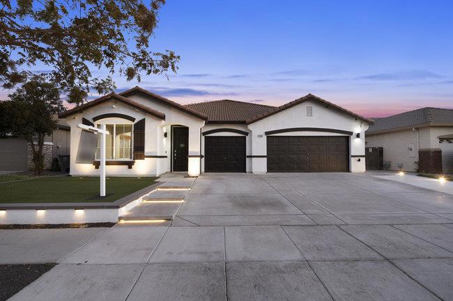 Spacious single-family home with 4 bedrooms, 2 bathrooms, and a 3-car garage in the highly sought-after Mission Estates neighborhood. The updated kitchen features sleek quartz countertops, black stainless steel appliances, and a large island with seating for four. The great room and separate family room showcase luxury vinyl plank flooring, while the bedrooms offer plush carpet. Additional highlights include a formal dining area and a primary suite with a walk-in closet, soaking tub, and shower. Step outside to a fully landscaped, low-maintenance yard with automatic irrigation and a built-in stacked stone fire pit perfect for entertaining. Conveniently located near Grasslands Elementary, Los Banos Junior High, and Pacheco High School.