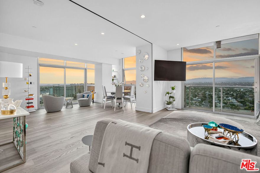 Presenting Penthouse 1911, a meticulously renovated residence situated in the prestigious, full-service high-rise AZZURRA. This exceptional corner unit offers direct, unobstructed views of the Marina, Ocean, City, Santa Monica Bay, and surrounding mountains. The penthouse is fully furnished with premium Italian designer pieces and showcases recent top-to-bottom enhancements, including wide plank white oak flooring, motorized Lutron window treatments, and an expertly appointed chef's kitchen with top of the line Miele appliances, quartz countertops, and custom European cabinetry.Natural light floods the space throughout the day, enhancing designer finishes and providing a sense of privacy and sophistication. The primary suite features a luxurious en-suite bath and an expansive walk-in closet with custom built-ins. The second bedroom/den is equipped with a motorized wall for additional privacy when configured as a bedroom, a custom Murphy bed, and a refined bathroom featuring a separate shower and freestanding tub.Additional highlights include two balconies, 10-foot ceilings, custom lighting, a smart thermostat, in-unit washer/dryer, and two covered parking spaces. Lease terms include cable, internet, water, trash, and access to exclusive amenities: 24-hour valet service for guests, front desk security, concierge, rooftop spa and sky lounge with panoramic views, outdoor kitchen and BBQ area, heated saline pool and spa, business center, media lounge, curated art collection, and a state-of-the-art indoor/outdoor fitness center with dry sauna and yoga/Pilates studio.Conveniently located moments from world-renowned beaches, marina access, upscale shopping and dining, LAX, parks, bike paths, dog walks, theaters, and more. Available for lease from November 1st through May 31st.