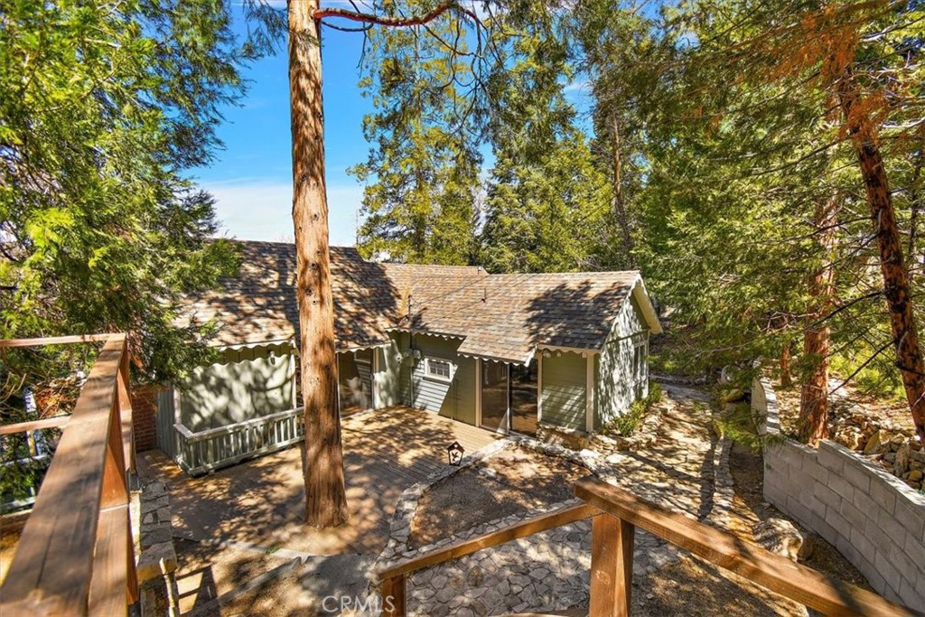 Charming 1930’s Cabin in Twin Peaks!
Perfect for family and friends, this spacious cabin offers plenty of room to relax and enjoy mountain living. Tandem parking accommodates up to three cars. The main floor features a kitchen, dining area, living room, half bath, and a bedroom. The lower level hosts two additional bedrooms, each with its own ensuite bath, ideal for privacy and comfort. Relax on the rear deck with scenic, tree-lined views. The flat front yard is perfect for landscaping projects, and a cozy coffee deck off the main bedroom adds charm. Updated electrical and less than two hours from LA, Orange, and San Diego counties—your mountain escape awaits!