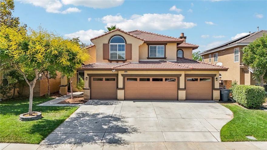 Sophisticated Wildomar Home with Grand Staircase, 4-Car Garage & Solar!



Enter into elegance with this spacious 5-bedroom, 3-bathroom home, featuring a full bedroom and bathroom on the main level and a rare 4-car garage. The moment you enter, the dramatic grand staircase captures your attention and sets the tone for the home’s refined style.



The open kitchen has been beautifully upgraded with granite countertops, designer subway tile backsplash, walk-in pantry, and abundant cabinetry. It also features a hood vented to the exterior (not recirculating) and flows seamlessly into the family room, creating the perfect space for entertaining and everyday living. Formal living and dining areas add to the home’s versatility.



As a previous model home, this property boasts dual fireplaces and added upgrades throughout. It is also wired for sound/music with speakers installed downstairs and in the primary suite. The laundry room offers extra convenience with a dedicated sink.



Upstairs, the primary suite is a private retreat complete with its own balcony, large walk-in closet, and a spa-like bathroom with soaking tub and separate shower. Additional bedrooms are generously sized, and a convenient media desk area is perfect for a small office or study nook.



With fresh interior paint, brand-new carpet, and move-in ready condition, this home is as beautiful as it is functional. A 27-panel solar system with a lease of $212/month provides energy efficiency and cost savings, while the backyard offers a covered patio for gatherings or relaxation. Located with easy access to the 15 Freeway, this home is ideal for commuters. Best of all, there are NO Mello-Roos—just a gorgeous home with incredible features in a prime location.