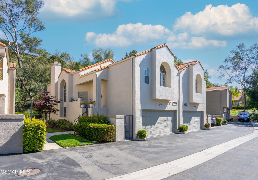 Huge price reduction! Best-priced 3-bedroom in the entire community--seller wants it sold! This exceptional end-unit townhome is perfectly situated next to the scenic Rocky Peak Park in the highly desirable California West community. Move-in ready, the home offers a spacious and light-filled floorplan with soaring vaulted ceilings that enhance the open, airy ambiance. The upper level features the main living areas, including the kitchen, dining, and family room, along with a private and expansive primary suite complete with high ceilings and a large walk-in closet. The lower level includes a versatile den, two additional bedrooms, a beautifully remodeled full bathroom, and a separate laundry area. Sliding glass doors lead to a private patio, ideal for relaxing or entertaining outdoors. The attached two-car garage offers generous built-in storage and cabinetry. Residents enjoy access to resort-style amenities, including a large pool, spa, BBQ area, and inviting lounge spaces. With its ideal layout, end-unit location, and incredible value, this is an opportunity not to be missed.