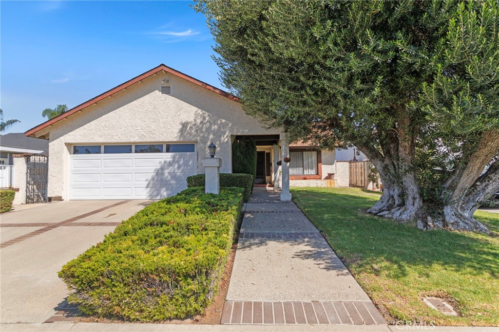Welcome to this single-story home tucked away in a peaceful cul-de-sac neighborhood of Laguna Hills! This beautiful residence offers a spacious floor plan, timeless features, and endless potential to make it your own. The inviting living room showcases a brick fireplace, wood-style flooring, and a large front window that fills the space with natural light. A charming dining area flows into the kitchen, complete with tiled counters, abundant cabinet storage, and a breakfast nook with sliding doors that open directly to the backyard. The primary suite includes mirrored closet doors, a private bath with a walk-in shower, and a view of the backyard. Two additional bedrooms and a full bath provide comfortable space for family, guests, or a home office. Step outside to enjoy a private backyard retreat featuring a large covered patio, perfect for dining, entertaining, or relaxing in the shade. The yard offers beautiful landscaping, privacy fencing, and plenty of room for gardening, pets, or play. Additional highlights include an attached 2-car garage and a wide driveway. This home offers privacy while still being just minutes from top-rated schools, local parks, popular restaurants, and easy freeway access to both the 5 and 133. With solid bones and a fantastic location, this property is a rare opportunity to customize and enjoy all that Laguna Hills has to offer.