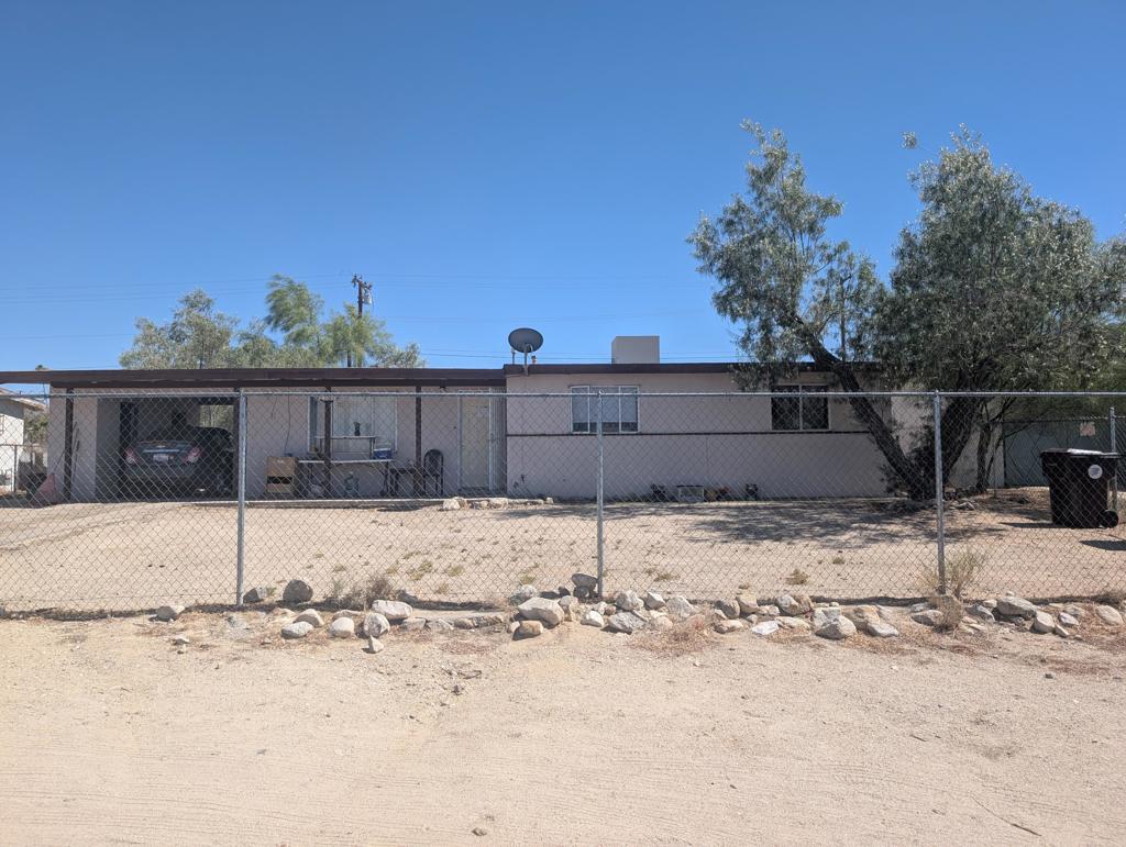Investors Dream! Bring your speculators/flippers or buy and hold clients. Airbnb homes on this street make it a possible short term or long term rental. Military Base nearby could be a great source for tenants .Open wood beam ceilings. Good bones; needs a makeover inside. Large fenced yard. South side of 29 Palms near the foothills, school and Tortoise Rock Casino. Downtown shops and restaurants nearby. Great Opportunity as it is close to the entrance of the Joshua Tree National Park.