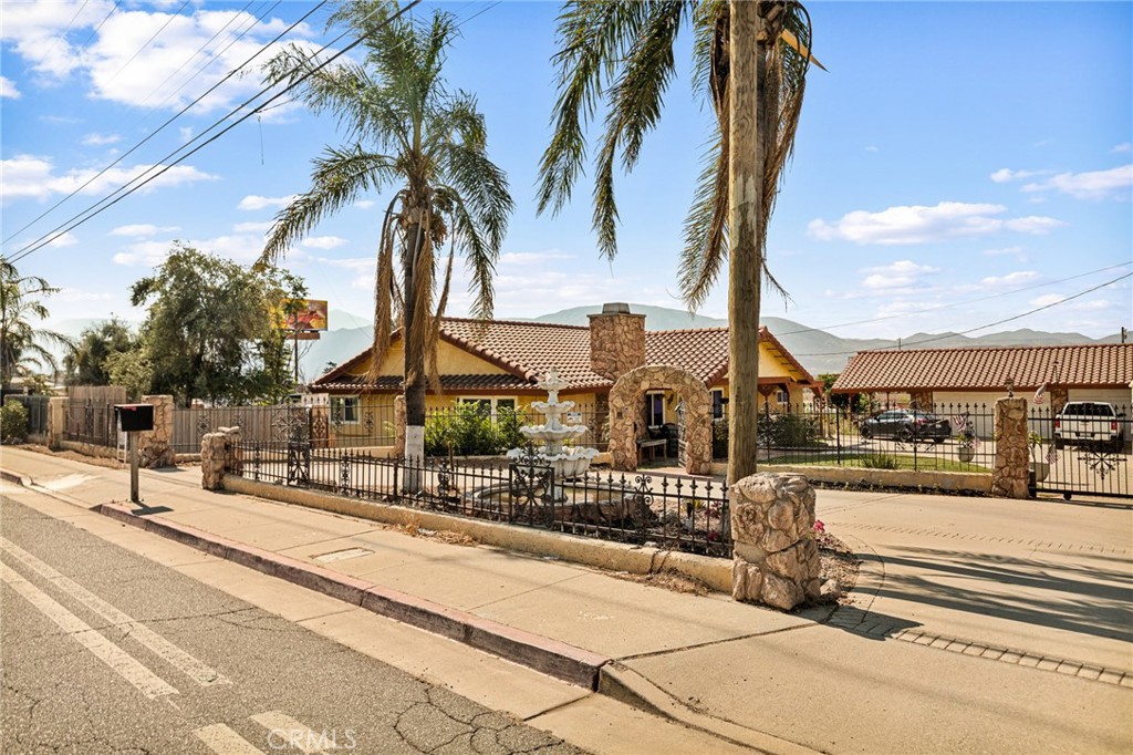 This stunning Spanish-style home, spanning 1,670 square feet, exudes timeless elegance and modern comfort. With 3 bedrooms and 3 bathrooms, this residence is designed for both relaxation and entertaining. The exterior boasts classic stucco walls, a red-tiled roof, and arched doorways, capturing the essence of Mediterranean charm.
Step inside to an open-concept living area with exposed wooden beams, warm laminate flooring, and abundant natural light. The gourmet kitchen features granite countertops,, and a center island, perfect for culinary creations. The master suite offers a private oasis with a luxurious en-suite bathroom, complete with a tub and walk-in shower.
Each of the two additional bedrooms is generously sized, with ample closet space and easy access to well-appointed bathrooms. The highlight of this property is the charming casita, a versatile space ideal for guests, a home office, or a private studio, complete with its own bathroom and kitchenette.
Outside, a beautifully landscaped courtyard with a fountain invites al fresco dining, while the backyard offers a tranquil retreat.. This Spanish-style gem blends classic architecture with modern amenities, creating a perfect haven for your lifestyle.