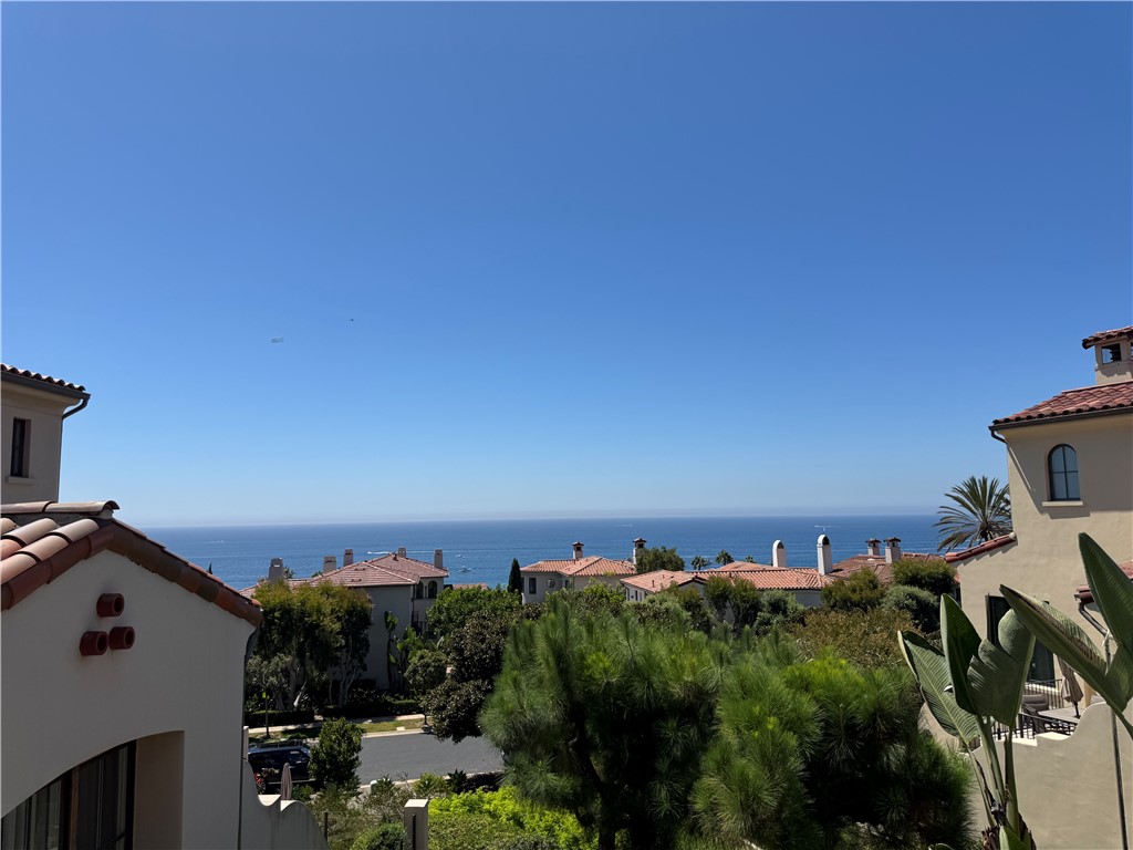 Nestled in the prestigious gated community of Crystal Cove, 132 Sidney Bay is a seascape villa offering breathtaking sunsets every day. Its fresh, modern aesthetic and the ultimate coastal lifestyle are evident. This 2,908-square-foot home boasts four bedrooms and 4.5 bathrooms. The main floor boasts one bedroom and one bathroom. The kitchen features WOLF and SubZero appliances, including a refrigerator. Off to the side is a dining area, a light-filled living room, and a family room, complete with a fireplace. Wide sliding doors open onto a private patio for al fresco dining. Upstairs, the master suite boasts stunning ocean and sunset views of Catalina Island, two walk-in closets, and a spa-style bathroom. Bedrooms 3 and 4 each open onto spacious, sun-filled balconies. Crystal Cove offers privacy and security, while also being within walking distance of beautiful Crystal Cove Beach, State Park, and shopping, as well as convenient access to upscale community amenities like the Canyon Club.