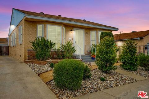 Photo of 8719 Cimarron Street, Los Angeles, CA 90047 (MLS # 26678771)