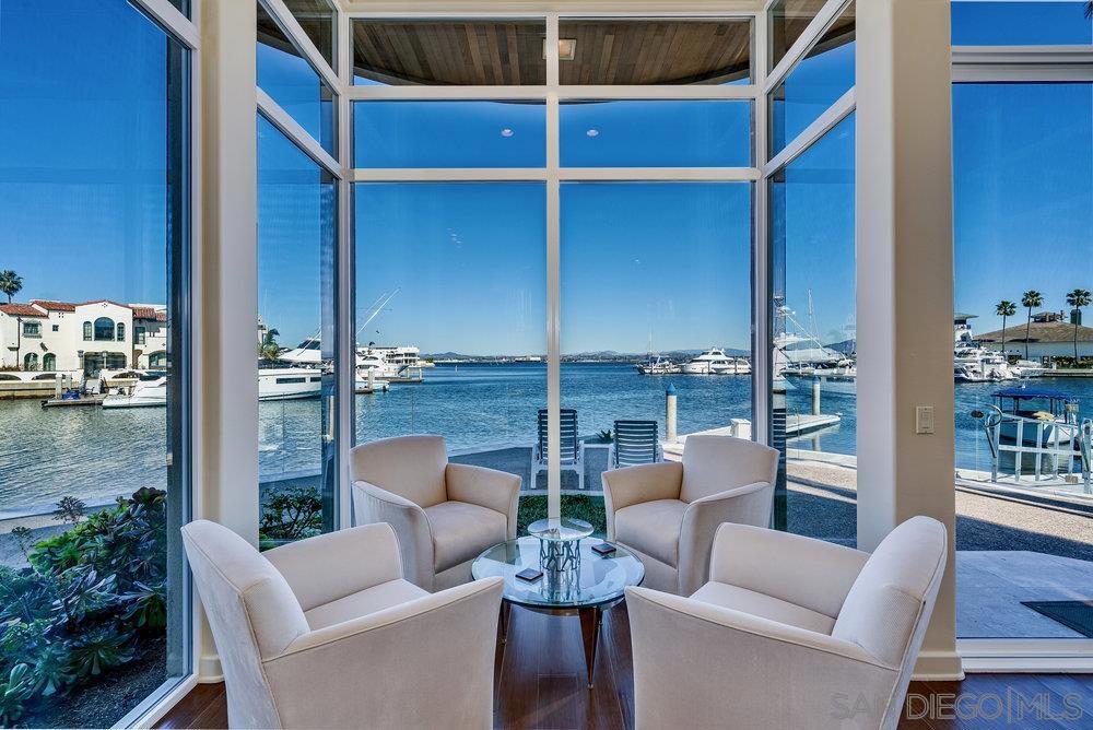 ONCE IN A LIFETIME OPPORTUNITY TO OWN THE BEST HOUSE IN THE BEST LOCATION IN THE CORONADO CAYS WITH OVER 130' of PRIME WATERFONT ON A CORNER LOT WITH SPACE FOR A 100'+ YACHT. BEAUTIFUL CUSTOM 6400 SQUARE FOOT HOME BY RENOWNED ARCHITECT JOSEPH CRISTILLI. VAULTED CEILINGS THROUGHOUT, HUGE LIVING ROOM WITH TRAVERTINE PATIO. LARGE DEN, KITCHEN AND DOWNSTAIRS BEDROOM. ELEVATOR. CHILLED WINE CELLAR. NEW ROOF. NEW AC/ FURNACE UNITS. MASTER BEDROOM AND DECK WITH COMMANDING 280 DEGREE VIEWS OF OPEN BAY, CHANNELS, AND YACHT CLUB INCLUDING HIS AND HER MASTER BATH AND CLOSETS. BOOSTING OVER 8000 SQUARE FEET OF WHARFAGE ON TWO SIDES WITH TWO BOAT SLIPS AND A U-SHAPED DOCK WITH ROOM FOR ONE 80' YACHT AND A 100'+ YACHT! FACING EAST PROTECTED FROM ELEMENTS. YOUR UNIQUE ONE-OF-A-KIND DREAM HOME AWAITS! New photos posted!