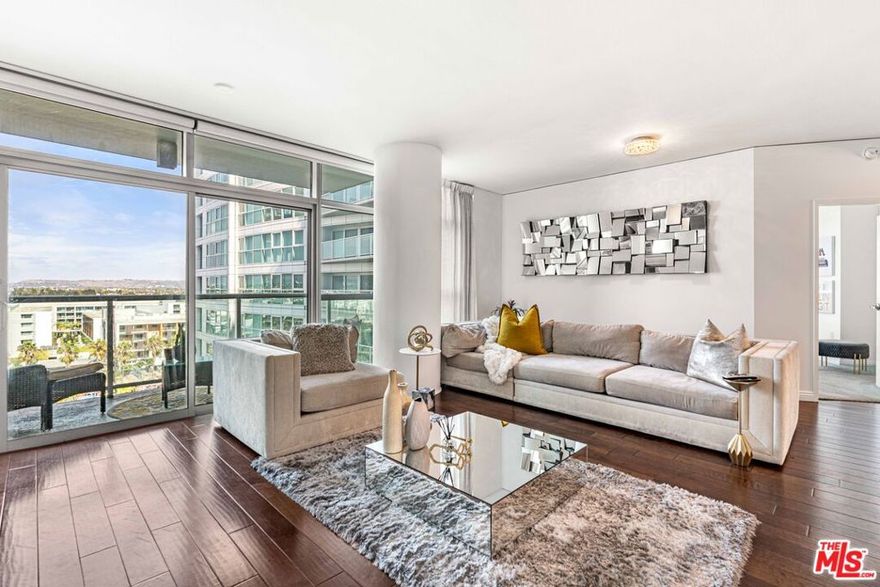 Designer done & upgraded 2BD/2.5BA in the COVE- Marina Del Rey's most prestigious high-rise development. Unit boasts a Spacious and open living room with separate large dining area. Enjoy unobstructed city lights and mountain views from virtually every room and the oversized balcony. Cook's and entertainer's dream with a large open gourmet kitchen, new white quartz counter tops,  stainless steel refrigerator, new gas range, stainless-steel Bosch appliances & Studio Becker cabinets. Huge master bedroom and bath with separate shower and soaking tub, new quartz counters w/ dual sinks and generous storage. This condo boasts Mahogany wood floors, upgraded carpet, custom drapery in all rooms with black out shades in master, new custom paint in all rooms transform this unit into a designer showplace. The Cove is a full service building providing a 24 hr. desk, valet parking for residents and guests, pool, hot tub, outdoor BBQ , gym, rec lounge, library, conference room & guest suite. HOA includes water, trash, gas , internet and Direct TV.