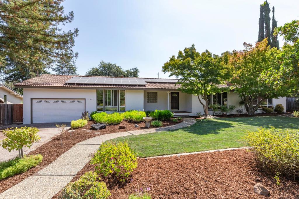 Sitting on a manicured 11,200 square foot lot in premier North Los Altos, this freshly updated ranch home features a light-filled single-level floor plan with an ideal neutral color palette, vaulted ceilings, and open-concept living spaces. The remodeled eat-in kitchen features stunning quartz countertops, stainless steel appliances, and a casual dining area that opens directly to a large pergola-covered deck overlooking the yard. Just next door, the dining room has a candle-style chandelier and a wall of front-facing windows. The living and family rooms share a central to-the-ceiling brick fireplace, and the family room has soaring vaulted ceilings highlighted by rich wood. The primary suite also enjoys vaulted ceilings, and has a large walk-in closet, and glass doors to a private patio with steps down to the yard. Outside, a bocce ball court is surrounded by a pebblestone patio, and the expansive yard continues with mature landscaping, trees, and garden areas. A sprawling, turn-key home on a quiet cul-de-sac in the heart of North Los Altos just moments from all of the wonderful shops and restaurants in downtown Los Altos and with access to top-rated schools.