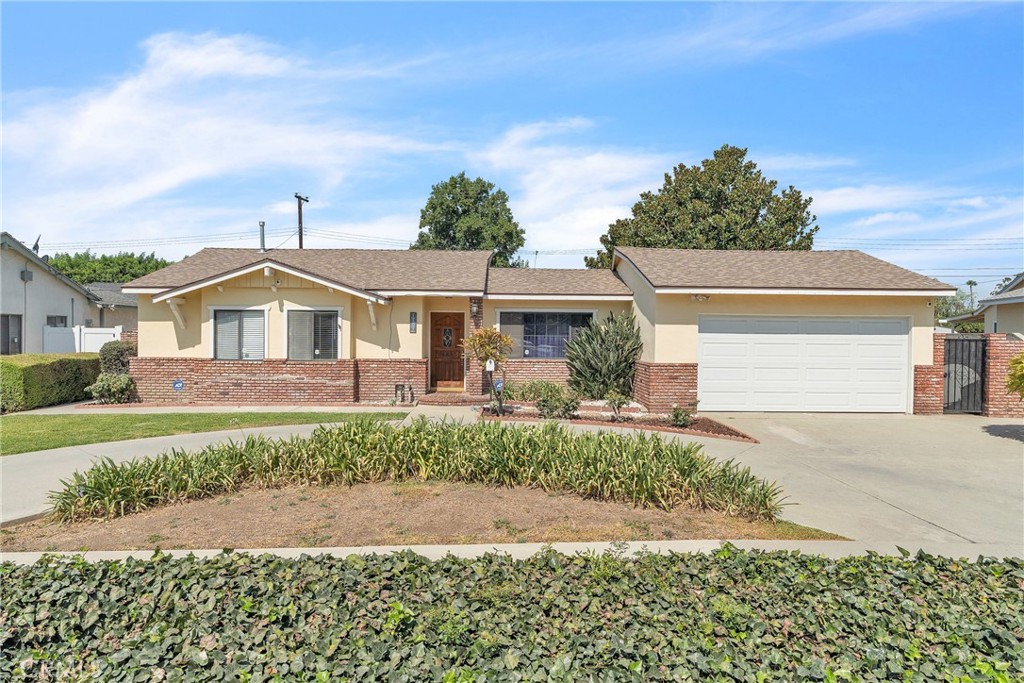 Tucked away in a highly desirable West Covina neighborhood, this 3-bedroom, 2-bathroom home effortlessly combines timeless charm and comfort. With 1,589 square feet of thoughtfully designed living space on a generous 8,673 square foot lot, this property is a true standout. The curb appeal is undeniable, featuring a lovely front yard, a very spacious driveway, Inside many windows and sliding doors provide abundant natural light, offering picturesque views of the expansive backyard, complete with mature trees and plenty of space to unwind. Step into a cozy living room perfect for relaxing evenings. The living room, kitchen and dining room open to a covered patio, creating a seamless indoor-outdoor flow ideal for entertaining or al fresco dining. The primary bedroom offers a peaceful retreat with lots of custom storage, while two additional bedrooms provide plenty of space for family, guests, or a home office. There is additional space in the family room for cozy evenings by the fire with access to the beautiful backyard. Recent updates, include a newer roof and HVAC ensure comfort and convenience from day one. Both baths were tastefully remodeled just a few years ago. A two-car garage adds extra functionality and storage. So much custom storage! The large yard has potential for an ADU and a personalized garden if you wish. The local elementary school is walking distance. This home is just waiting for your personal touches. Situated just minutes from the 10 Freeway, West Covina Mall, and a wide array of dining options, this home perfectly balances suburban tranquility with easy access to shopping, dining, and entertainment. Whether you’re hosting in the backyard or savoring the peaceful neighborhood vibe, this home is the ideal retreat, This treasure won’t last long, schedule your tour today and make it yours!