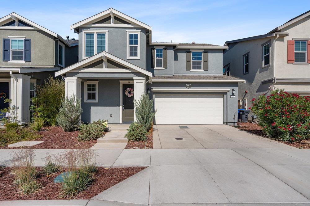 Welcome to 7221 Diamond Ave an **EAST-FACING**, move-in ready home offering the perfect blend of comfort, style, and convenience. Located just minutes from Highway 580 & the ACE Rail, this nearly new 2-year-old home provides easy access to the Bay Area and Silicon Valley. Inside, you'll find 4 spacious bedrooms & 3 full bathrooms, including a full bed & bath on the main floor; ideal for guests or MULTI GENERATIONAL living. The open-concept kitchen features shaker style cabinets, large island with quartz countertops, a spacious pantry, gas stove, & stainless steel appliances all of which are included, along with window blinds. Enjoy the added comfort of LVP flooring, new white recessed lighting downstairs & updated ceiling fan light fixtures throughout the home. Additional highlights include owned solar, a tankless water heater, EV charging prewire, and a finished 2-car garage. The low-maintenance front yard adds curb appeal, while the backyard is a blank canvas ready for your own vision. Situated in a desirable community with **GREAT SCHOOLS**, residents also enjoy access to a beautiful **community pool**, picnic areas, & walking trails great for relaxing or staying active close to home. Don't miss your chance to own this thoughtfully upgraded, investor, commuter-friendly gem!