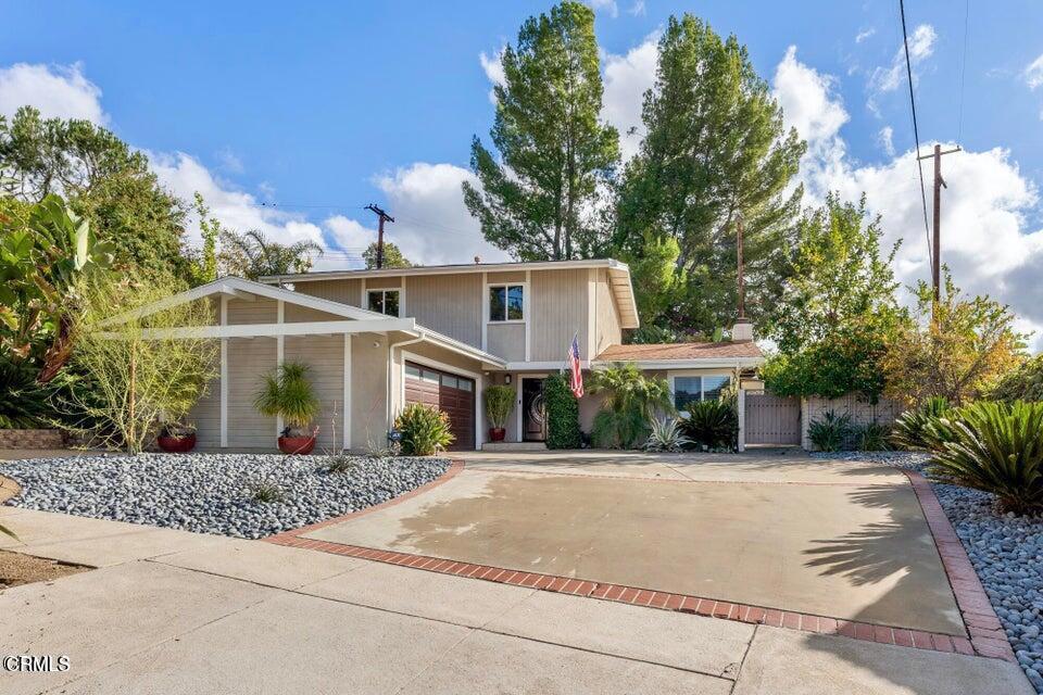 Welcome Home! Located on a long cul-de-sac with beautiful mountain views, enter the double doors to the spacious living room with floor to ceiling fireplace and sliding doors that open to the backyard and pool area. The kitchen is open to the dining room, which also has sliding doors leading to the side yard. There is a bonus room downstairs with a closet that can be used as a 4th bedroom and/or home office. All 3 bedrooms are upstairs. Relax in your heated pool and spa. The backyard/patio has a sitting area and Zen rock garden. The landscaping is drought tolerant and includes drip system and sprinklers. Enjoy the numerous fruit trees which include blood and naval oranges, Meyer and regular lemons, lime, grapefruit, pomegranate, and pomelo. A brand new roof, new pool motor and new drip system have been added in 2024.