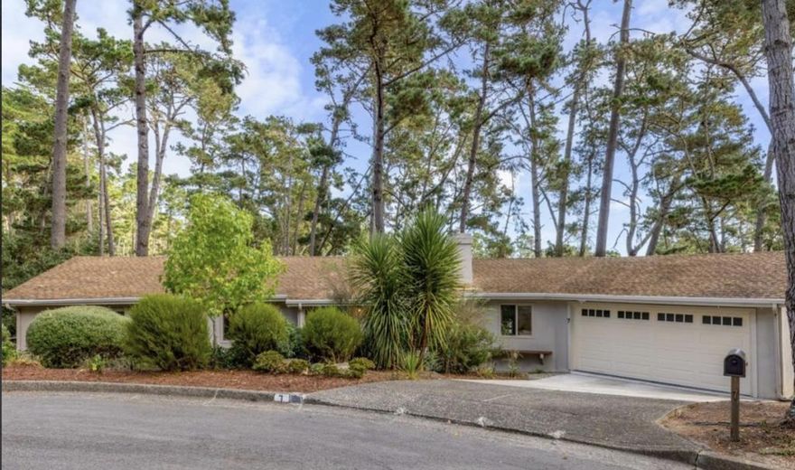 Welcome to 7 Wyndemere Vale, nestled at the end of a serene cul-de-sac in the tranquil Skyline Forest.  This 4-bed, 3-bath home offers the perfect balance of elegance and comfort. Spread across approximately 1,940 square feet on a generous almost half acre lot, this residence welcomes you with vaulted open-beam ceilings, Saltillo tile, and a stately Carmel-stone fireplace in the living room. The updated kitchen, with granite countertops and oversized windows, frames stunning greenbelt views with a glimpse of Monterey Bay.  The mostly single level home, includes a main level boasting three bedrooms, including a primary ensuite, while downstairs you'll find a private guest suite with its own entry and full bath ideal for visitors, a private office or multigenerational living. Thoughtful updates to flooring, lighting, cabinetry, windows, and more make this home move-in ready.   Outside, three decks invite al fresco dining or quiet relaxation amid forested views, and a fenced garden area adds charm and privacy.  Complete with an oversized two-car garage, it's the perfect home for commuting and exploring. Conveniently located just minutes from Pebble Beach, Carmel, Pacific Grove, golf, and coastal trails, this peaceful retreat is Peninsula living at its finest.