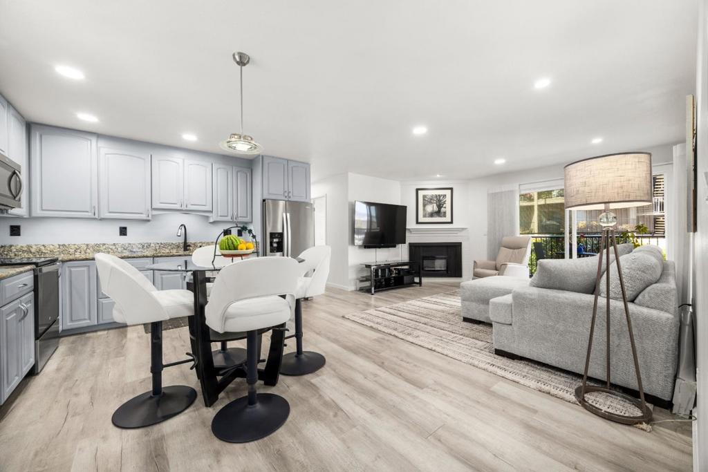 Just a short walk from downtown Capitola, Unit #102 blends modern interior updates with a rare coastal setting that feels both connected and quietly removed. Inside, the kitchen, bathrooms, and floors have all been thoughtfully renovated with clean lines and a modern touch. The open-concept layout feels inviting, stylish, and completely move-in ready. The community features a pool, a rooftop deck with wide-open coastal views, and direct access to a walking path that leads down to the beach, perfect for spontaneous sunset strolls or morning surf checks. The patio deck offers a front-row seat to the ocean whales in the distance, seabirds overhead, and the occasional sea otter drifting by. It's quiet here, but full of life. Walk into town in minutes, or stay in and watch the ocean to remind you why you live here.