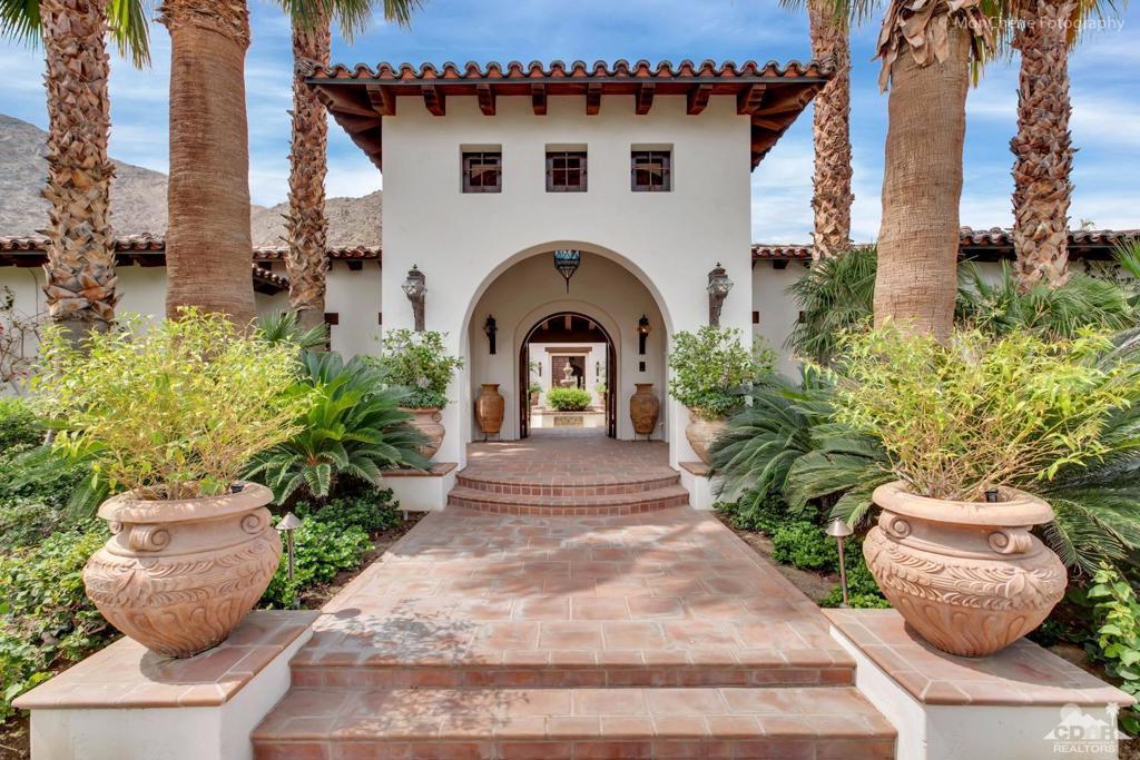 Got Cars! 8 car garage ! The Ultimate Hacienda Style Masterpiece! Sparing no expense, the owners traveled the world for the finest materials to create a Charles Howell architectural wonder. With fireplaces in all 4 Bedrooms, leather floor Office and a Don Quixote Bar, it is rich with fine detailing and dozens of antique doors - every room tells a story. Meander downstairs to an underground Living Room, 8 to 10-car garage & custom wood golf locker room. Built on one of the best lots in Tradition w/ south mountain views of holes 15 & 16. Truly a magical spot in the shadow of the famed Indians' Talking Rock where you'll spend your evenings with friends and family gathered around an outdoor fire pit and spacious rear lawn. With stunning courtyard, dual spas, towering Entry and Hallways, groin vault brick ceiling in the Dining Room, custom flooring from Spain, this Hacienda Style home with light and bright white walls will never go out of style. Offered partially furnished per inventory.