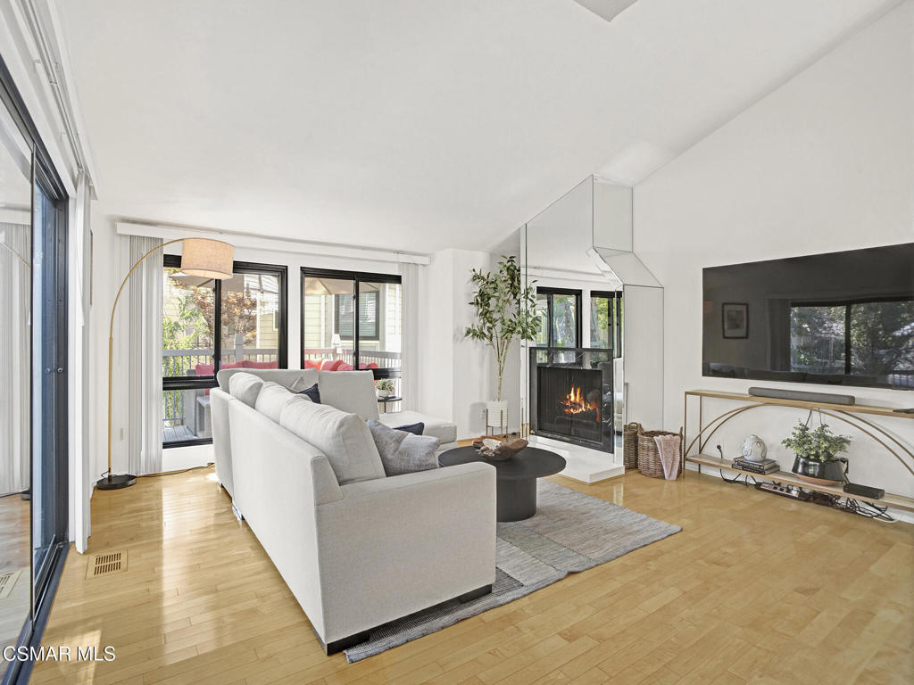 Welcome to this beautifully updated 2-bedroom, 2.5-bath townhome offering a perfect blend of modern design, natural beauty, and comfort. Ideally positioned to capture stunning mountain and lake views from the bedrooms, this home delivers a serene Westlake Village lifestyle. The interior features a modern kitchen with stylish laminate cabinetry and a sleek, contemporary design ,ideal for both daily living and entertaining. The spacious living area is highlighted by maple wood flooring and a striking Nero Marquita marble fireplace, creating an atmosphere of understated elegance.Abundant windows throughout the home fill the space with natural light, enhancing the open and airy feel. Step outside to the patio, perfect for relaxing or entertaining while enjoying the peaceful surroundings. Additional features include two enclosed single-door garage, providing convenient parking and extra storage. Located near walking paths, shops, restaurants, and everything Westlake Village has to offer, this townhome is an ideal blend of tranquility and convenience.