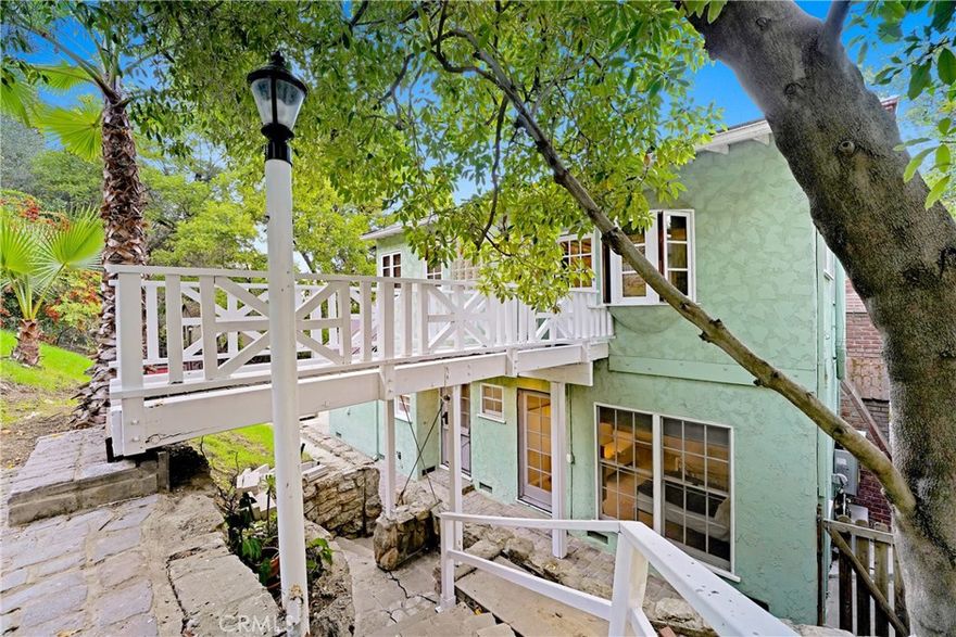 This charming three-bedroom, two-bathroom Cape Cod–style home in Studio City is nestled on a serene hillside and sits on an expansive 12,000+ sq ft lot, offering beamed ceilings, laminate wood floors, and abundant character throughout. The spacious primary suite features a wet bar, walk-in closet, and private entrance, while the third bedroom downstairs includes its own fireplace, perfect for guests or a private retreat. The cozy living room also has a fireplace, and the formal dining room offers flexible use as an office. Ideal for entertaining, the backyard features a wood deck with tranquil treetop views. All located just minutes from top-rated schools including Harvard-Westlake and Campbell Hall, as well as Erewhon and the shops and restaurants of Ventura Boulevard.