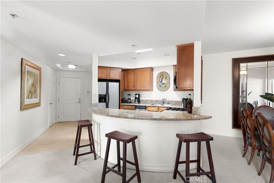 Welcome to this move-in ready, 3-bed, 2-bath top-floor condo located in desirable Sherman Oaks. Designed for modern living, the spacious open-concept floor plan features an updated kitchen outfitted with stainless steel appliances, a formal dining room and inviting living room with a sliding glass door that opens to a private balcony. The generously sized primary suite boasts a walk-in closet and ensuite bathroom, complete with a soaking tub, large shower and double vanity. The two additional bedrooms and full bathroom are thoughtfully situated on the opposite wing of the home, ensuring privacy and separation from the primary. Additional highlights include in-unit laundry, secure garage parking and access to a communal rooftop lounge. Ideally located within an excellent school district and nearby local shops, cafés and restaurants.