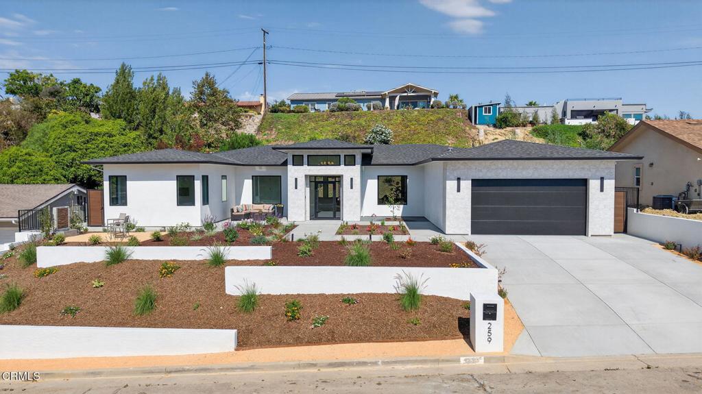 Welcome to Ondulando! A rare opportunity to own a brand-new construction home in one of Ventura's most sought-after neighborhoods. This modern single story residence is crafted with unparalleled attention to detail, thoughtful design, and high-end finishes. Inside you are greeted with an open concept floor plan perfect for entertaining and featuring elegant white oak engineered hardwood floors throughout. The chef's kitchen showcases top of the line appliances, a striking 9-foot center island, and a seamless flow into the spacious living room with 74' WiFi-enabled color changing LED fireplace adding to the inviting ambience of the home. This 4-bedroom, 4-bathroom masterpiece redefines luxury living with its split wing layout featuring two primary suites with incredible bathrooms with modern finishes, and each with private access to the covered patio. The extra spacious laundry room with ample cabinet space provides additional storage along with the two entry closets and hallway linen closet. Every detail was designed with efficiency and comfort in mind: individually zoned mini-split heating and cooling, a fully integrated solar system pre-wired for backup battery, EV charging readiness, and Halo 5 whole house water filtration system. Smart home upgrades include Ring doorbell, Sonos sound system with iPad control, and more! Spacious two car garage complete with epoxy finish. Step outside to your own private outdoor retreat featuring multiple sitting and dining areas, a fully equipped outdoor kitchen, fire pit, and tranquil fountain--the perfect setting for gathering year-round. From smart design to outdoor entertaining, this home delivers everything you've been waiting for! Come experience the perfect blend of luxury, innovation, and California living in this one-of-a-kind Ventura home.