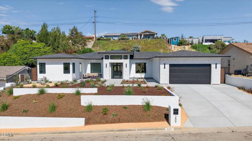 Welcome to Ondulando! A rare opportunity to own a brand-new construction home in one of Ventura's most sought-after neighborhoods. This modern single story residence is crafted with unparalleled attention to detail, thoughtful design, and high-end finishes. Inside you are greeted with an open concept floor plan perfect for entertaining and featuring elegant white oak engineered hardwood floors throughout. The chef's kitchen showcases top of the line appliances, a striking 9-foot center island, and a seamless flow into the spacious living room with 74' WiFi-enabled color changing LED fireplace adding to the inviting ambience of the home. This 4-bedroom, 4-bathroom masterpiece redefines luxury living with its split wing layout featuring two primary suites with incredible bathrooms with modern finishes, and each with private access to the covered patio. The extra spacious laundry room with ample cabinet space provides additional storage along with the two entry closets and hallway linen closet. Every detail was designed with efficiency and comfort in mind: individually zoned mini-split heating and cooling, a fully integrated solar system pre-wired for backup battery, EV charging readiness, and Halo 5 whole house water filtration system. Smart home upgrades include Ring doorbell, Sonos sound system with iPad control, and more! Spacious two car garage complete with epoxy finish. Step outside to your own private outdoor retreat featuring multiple sitting and dining areas, a fully equipped outdoor kitchen, fire pit, and tranquil fountain--the perfect setting for gathering year-round. From smart design to outdoor entertaining, this home delivers everything you've been waiting for! Come experience the perfect blend of luxury, innovation, and California living in this one-of-a-kind Ventura home.