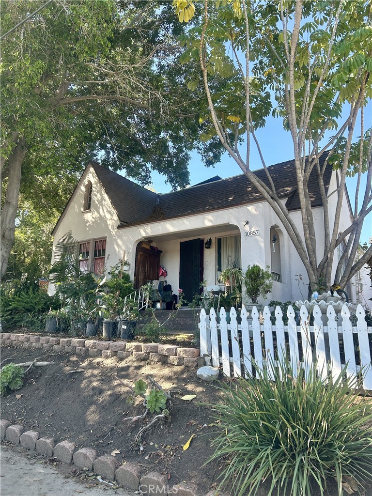 Investor's Dream! This home has so much original charm yet needs work. It has hardwood floors and additional living space with an upstairs attic. Spacious 2 bedroom, 1 bath with fireplace on a super sized lot at 8293 sq.ft. Solar panels, fruit trees and must see to appreciate the potiential.