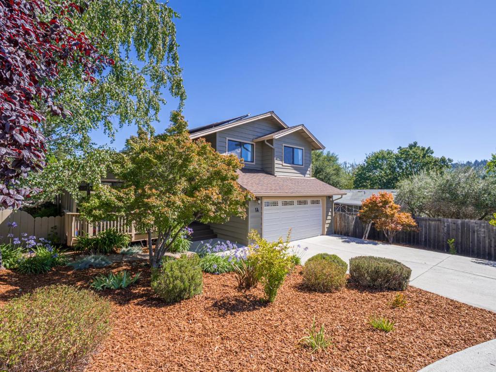 Just Listed in Scotts Valley! Neatly tucked away on a quiet cul-de-sac, not far off the beaten path, 14 Sageland Court is situated on a large sunny lot and features a versatile spacious open floorplan with vaulted ceilings, abundant natural light, warm wood floors, wood burning fireplace, and a combined kitchen, living, and family room space, perfect for family gatherings and entertaining with easy access to the backyard deck and pool. The well thought out sensible floor plan incorporates three upstairs bedrooms, including the primary bedroom and bath, with views of the backyard pool, and an additional main level bedroom and bath and inside washer & dryer area with an attached two car garage. This home also boasts many energy efficient upgrades ~ Solar electric panels, electrical storage batteries, EV charging station, on demand water heater, hydronic solar panels for heating the pool. Location Location Location! Take advantage of one of the most convenient locations in Scotts Valley, close to schools, a few minutes drive to Hwy 17 and walking distance to the local market and shopping center with restaurants, specialty shops, and just a ten-minute drive to the beach and downtown Santa Cruz and 20 minutes to Los Gatos.