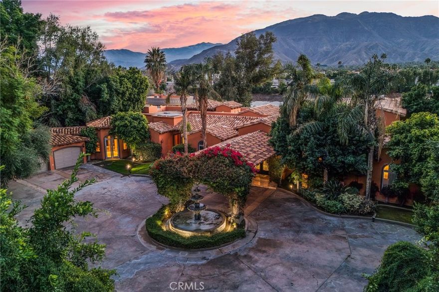 A rare architectural statement in Rancho Mirage blends luxury, artistry, and bold design across its 1.55-acre compound. With 9 bedrooms total, the main home offers 4 bedrooms, including an upstairs suite featuring a private full bath, three balconies, and a kitchenette. The separate guest house includes two bedrooms, a full kitchen, and a full bath, while four additional guest quarters sit just behind it, each with its own private bathroom. Floor-to-ceiling columns, sliding glass walls, and dramatic indoor–outdoor flow create a resort-like atmosphere anchored by a private pond, lap pool, and main pool. Every space feels sculptural, intentional, and primed for creativity. Designed for the entertainer and the big thinker, the estate offers expansive gathering areas, a grand lanai that opens fully to the grounds, and multiple zones for hosting, relaxing, or showcasing art. With its eclectic character, sweeping mountain views, and unforgettable presence, this property stands as a true one-of-a-kind opportunity