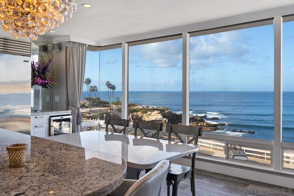 The Jewel- La Jolla Cove is a small beach surrounded by stunning seaside cliffs. It is one of the most photographed beaches in Southern California. This two bedroom oceanfront condo gives you an unobstructed view of the entire Cove. Stroll along the coast to see the sea lions and seals as the play and frolic. Walk to some of the most famous La Jolla Village restaurants including George's , Duke's, Eddie V's only to name a few. World class shopping is only steps away. In the summer months, the north facing La Jolla Cove is ideal for swimmers, snorkelers, and scuba diver's where water visibility can exceed 30 feet. This home features the most luxurious amenities... in the heart of La Jolla. No Pets.