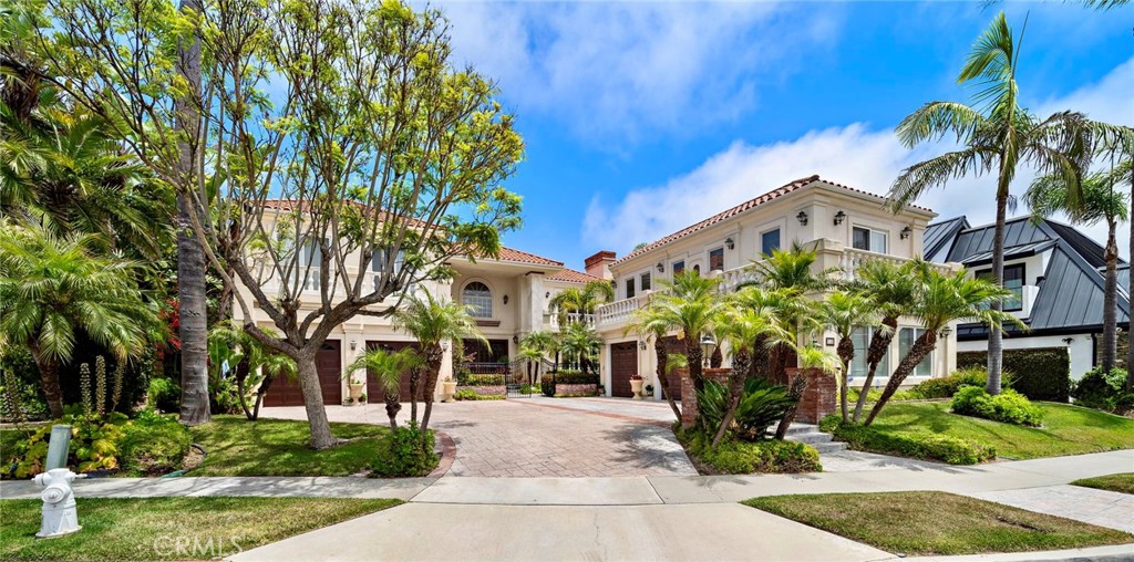 Discover the grandeur and nostalgia of the Guilded age. The magnificent bespoke estate crowns the top of prestigious Spyglass Hill, on the most coveted
cul-de-suc of the exclusive Custom collection of properties. Positioned to capture panoramic 200 degree views, the carefully curated, privately gated compound awaits for those with discriminating taste. Main level foyer impresses with the stunning iron framed circular staircase, lit with sparkles of the grand crystal chandelier and artfully inlaid stone floors. Generously proportioned, easy flowing formal living and family rooms are enriched by custom grand marble fireplaces. In addition, chef inspired kitchen, formal dining room and the office with built-ins complete the main level. Main house hosts six en-suite bedrooms, which include two luxurious primary suites commanding infinite mesmerizing sparkling night views. Five car garage suits all your autos accordingly.
Completely separate guest house accommodates visitors and live-ins providing all necessities and comfort, featuring a bedroom suite, a kitchen, direct separate garage access, laundry room and a sitting room completed with a beautiful fireplace. Spyglass Hill proximity to all local notables, world class shopping, gourmet restaurants, pristine beaches, Performing Arts Center, commute arteries, including John Wayne airport, makes it one of the most desirable locations in Newport Beach.