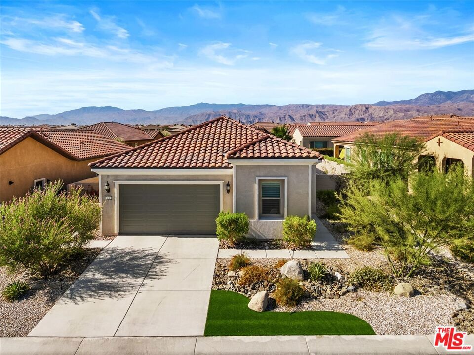 NEW LISTING ALERT: Looking for the perfect "Getaway"? 43 Zinfandel is a 2-bed, 2-bath home located in a nice pocket of Del Webb Rancho Mirage, a 55+ gated community. When you arrive at this home, you will see sunshine, an open floor plan, and a very large backyard. Complete with quartz countertops and high-end KitchenAid appliances. Porcelain tile floors throughout, except in the bedrooms, where you will find upgraded, Pulte Carpeting, nice to wake up and walk on. In the backyard, you will see a vast, spacious outdoor playground. It's perfect for a lovely outdoor evening around the custom-built fire pit, enjoying the mountain views. Both the front and the backyard are landscaped with desert-friendly plants and are easy to maintain. The clubhouse is where you will find a fitness center, two pools, a ballroom, a lounge, and so much more. There are many different clubs to join, and many ways of enjoying life. This home is perfect and is move-in ready. Don't miss it, you will be sorry.