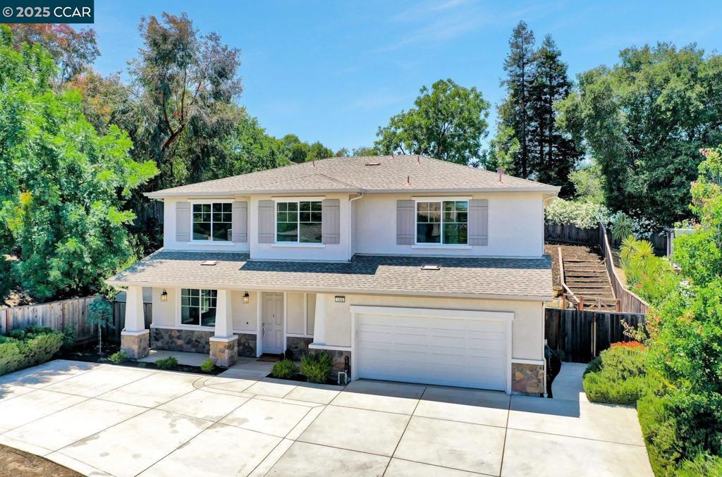 Gorgeous & Move-In Ready! Nestled in a private court off Cowell Road, this newer construction home offers comfort, space, and a fantastic location. The main level features two bedrooms, including a full en suite—ideal for guests—plus a half bath and a spacious open-concept kitchen, dining, and family room. Upstairs, a bright bonus area opens to a back deck, leading to a private primary suite with two walk-in closets and a luxurious bath with soaking tub, large shower, and dual vanities. Two additional bedrooms, a full bath, and a large laundry room complete the upper level. Enjoy a beautifully landscaped backyard with retaining walls, patio space for entertaining, a side yard with artificial turf, and a storage shed. The home also includes a two-car garage and two additional paved parking spots. Close to Ygnacio Valley Blvd, Treat Blvd, top-rated schools, Whole Foods, Trader Joe’s, and great local dining. Don’t miss this stunning home—it won’t last!