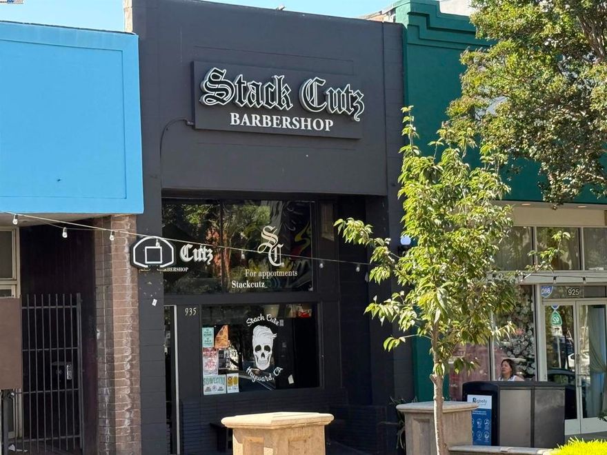 Single tenant retail/service building located in Downtown Hayward.  Older masonry building currently used as a barber shop.  The improvements are in average condition.  High ceilings, plank flooring, restroom, small office upstairs, Mitsubishi heating/air conditioning unit.  Rear door opens to alleyway. Free public parking in Downtown Hayward. Short walk to BART. Opportunity to keep existing tenant (presently month to month) or possibly occupy for new owner/user.