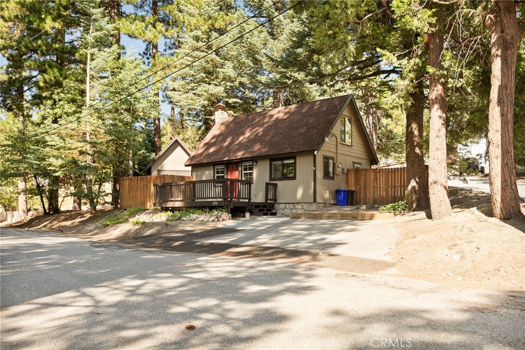 If You are Looking for the Cutest Little Cabin to Run Away to the Mountains for an AFFORDABLE PRICE, THIS IS IT!!! So Lovingly Maintained!! Very Easy Living Here with Totally Level Parking and Just a Couple Steps to the Door. Awesome Fenced-in Yard for the Pups with a Nice Little Sitting Area. YOU WILL LOVE the Cabin Charm Here with the Gorgeous Stone Fireplace... and Yes, it IS WOOD-BURNING!! Kitchen Has all that You Could Need and Indoor Laundry Here too!! Upstairs are 2 Cozy Bedrooms! Lots of Windows Throughout Bring in a Ton of Natural Light! This One is CLEAN AS A WHISTLE and Won't Last Long!! HURRY!!