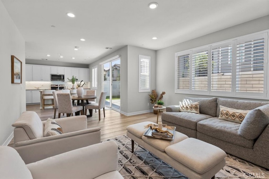 That spacious backyard you thought didn't exist in new construction? Found it! It's in Ontario Ranch—SoCal's fastest-growing community where demand is so high the cows moved out and all of the builders showed up. This stunning 2023 home delivers the lifestyle you've been chasing. Step inside to a magazine-worthy kitchen with gorgeous neutral quartz counters where you'll prep your favorite Pinterest recipes. The open-concept living and dining area practically glows with natural light, so your plants are going to be happy here. But here's the real showstopper: a genuinely spacious, private backyard that's practically unheard of in newer construction. Fire up the grill or chase your puppy around the yard—because you actually can here. Love having everything nearby? This home is minutes to Costco, In-N-Out, and Stater Bros, etc., not to mention the much-anticipated Grand Park that'll open next year. If you need to work from home, this house has plenty of rooms to make that happen. And if your work makes you show up somewhere, this location gives you perfect freeway access. The whole place shows like a model with builder upgrades throughout. Basically, you found your dream home.